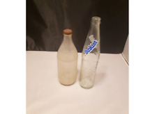 Set of two vintage old glass bottles