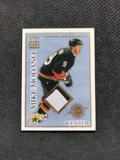 2003-04 PACIFIC CROWN ROYALE MIKE MODANO GAME-WORN JERSEY PATCH #ed 94/220