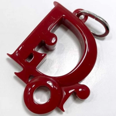 Portachiavi Christian Dior rosso argento plastica metallo cuore stella borsa ... - Immagine 1 di 4