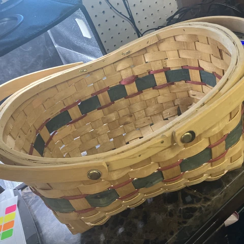 woven basket tan with green and red parts. AD Cover