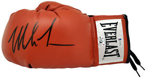 MIKE TYSON AUTOGRAPHED RED EVERLAST BOXING GLOVE LH IN BLACK BECKETT 182690