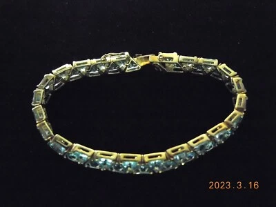 PULSERA FLEXIBLE ORO AMARILLO 18K CON TRIÁNGULO TOPACIO AZUL Foto 1 de 4
