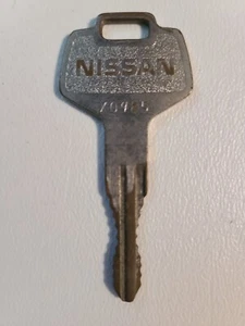 Vintage NISSAN MOTOR Automobile Key Number X0985 Brass - Picture 1 of 2