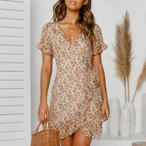 Vestido boho floral envolvente para mujer Mini vestido de sol manga corta vacaciones de verano para damas - Imagen 1 de 4