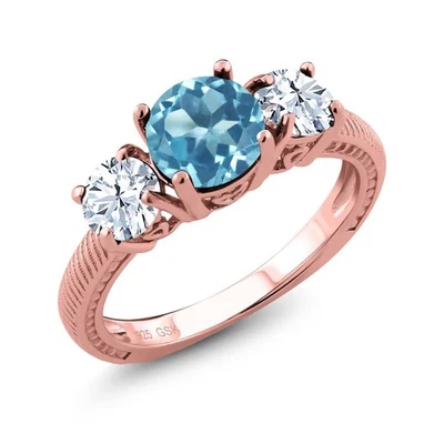 Anillo redondo de plata chapado en oro rosa de 18 quilates con topacio azul suizo de 2,90 quilates Foto 1 de 3
