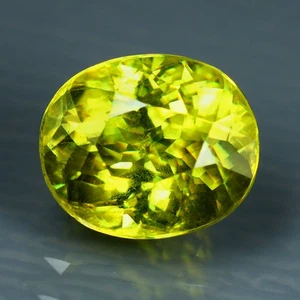 1.79 ct Phenomenal Oval (7.76 x 6.56 mm) Pakistan Multi Color Sphene Gemstone - Picture 1 of 3
