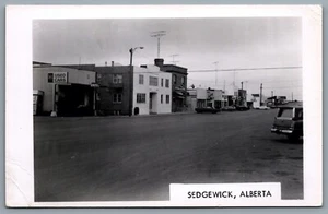 Postcard RPPC c1971 Sedgwick Alberta Street View Old Cars Rexall Co-Op Bank BMO - Picture 1 of 2