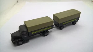 Tren colgante de plataforma Brekina 7220 MAN F8 gris grisáceo DEUTSCHE BUNDESBAHN (28) - Imagen 1 de 3