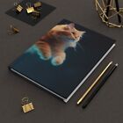 Cat Pouncing in Space Hardcover Journal - Unique Feline Art - Cosmic Adventure