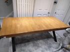 Solid wood dining table with soft edges and cross metal legs, very heavy