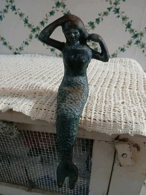 9” Cast Iron Green Patina Shelf Sitting/Reclining Mermaid Holding Hair Figurine - Image 1 of 4