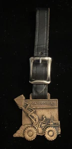 Vtg 1971 CATERPILLAR Watch Fob Bucket Tractor CONSTRUCTION Farm EQUIPMENT Strap - Picture 1 of 6