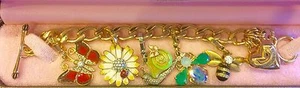 JUICY COUTURE "GARDEN CRITTER" CHARM BRACELET WITH 5 REMOVABLE CHARMS  - Picture 1 of 5