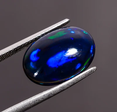 Piedra preciosa suelta cabujón forma ovalada ópalo etíope negro natural 3,5 quilates 14X10X4 mm Foto 1 de 3