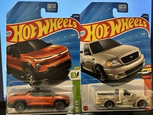 Hot Wheels Set Of Silverado EV RST & 99 Ford F-150 SVT Lightning - Picture 1 of 14