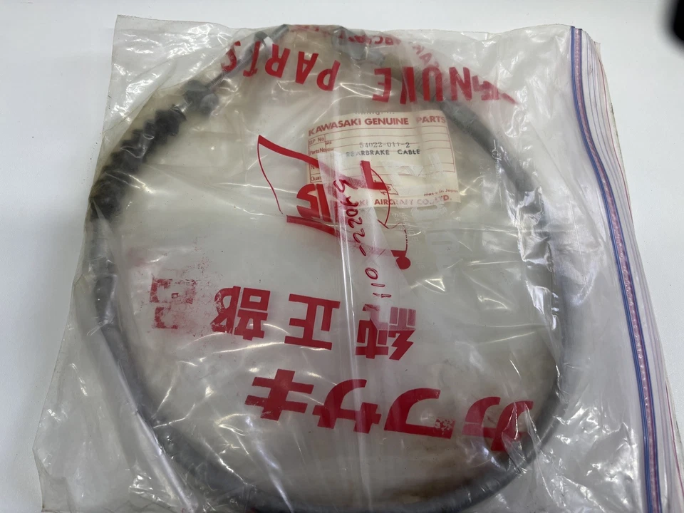 CABLE FRENO TRASERO KAWASAKI H1 500 h1 gris raro nuevo OEM genuino 69-71 54022-011 Foto 1 de 1