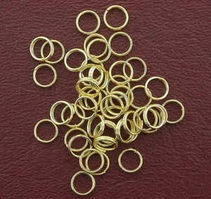 FORTY EIGHT 6mm ROUND GOLD PLATED SPRING  RINGS CF616 - Picture 1 of 1