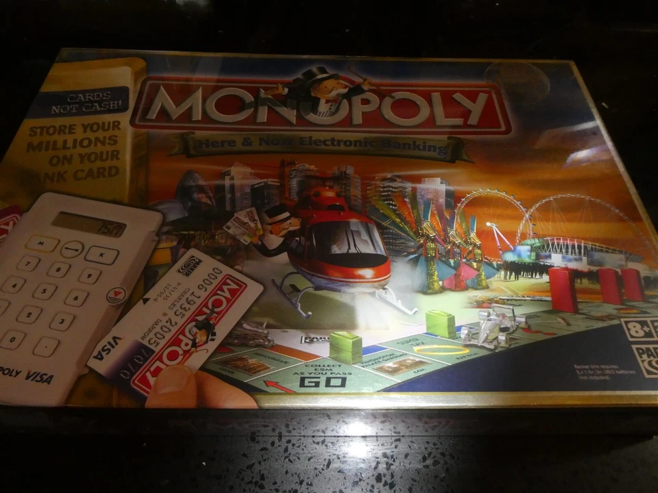 monopoly here and now electronic banking board game, new and sealed - Image 1 of 1