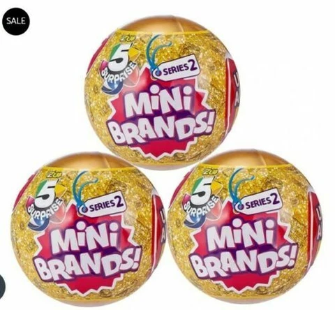3 GOLD BALLS 5 SURPRISE MINI BRANDS SERIES 2 NEW MYSTERY CAPSULE ZURU IN HAND Cover