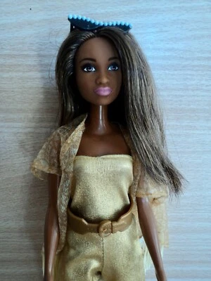 Barbie.  Fashionistas ( African Sculpt ) in a Gold Jump Suit, Wrap & Accessories - Image 1 of 3