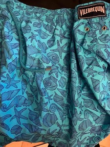 gold hibiscus print swim shorts