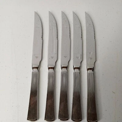 Juego de 5 cuchillos de cena de carne dentada de acero inoxidable para vajilla World 240 de 10-3/4" Foto 1 de 4