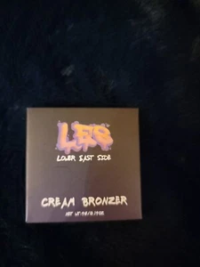 New In Box LES BEAUTY Cream Bronzer in SKYSCRAPER 4g/0.14oz - Picture 1 of 2
