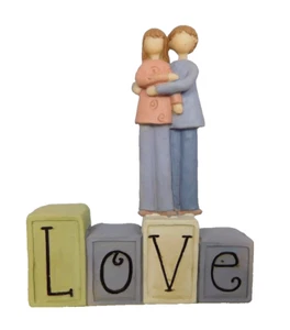Couple standing together on a LOVE block by Blossom Bucket #82987 - Picture 1 of 5