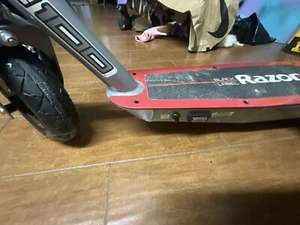 Razor E100 Electric Scooter, Pneumatic Front Tire, Hand-Operated Front Brake - Picture 1 of 4
