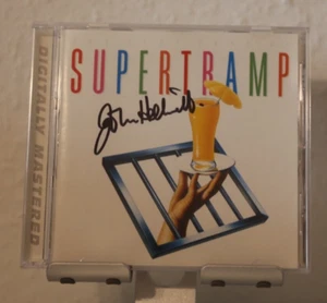 ORIGINAL Autogramm von John Helliwell. pers. gesammelt. Auf CD Cover. SUPERTRAMP - Picture 1 of 1