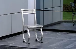 SEDIA CON GAMBE TONDE IN ACCIAIO INOX - Foto 1 di 1