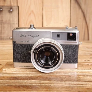 Fotocamera a pellicola rapida Minolta 24 difettosa - vano batteria corroso - Foto 1 di 7