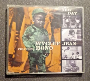 WYCLEF JEAN feat. BONO - NEW DAY /hip hop/rap/pop/U2/Fugees/Lauryn Hill/CDs - Picture 1 of 3