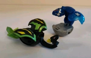 Set (2) McDonalds Bakugan Dharak schwarz/grün & Battle Bawler Razenoid Auquos - Bild 1 von 5