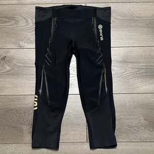 Skins A400 Kompression 3/4 schwarz gold Capri Leggings Größe Small - Bild 1 von 16