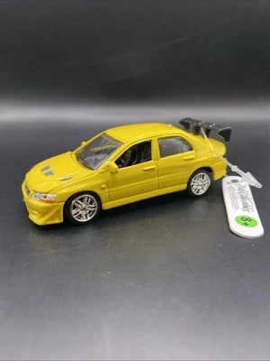 Ertl Collectibles Fast & Furious Mitsubishi Lancer Evo VII Yellow 1:64 Diecast - Image 1 of 4