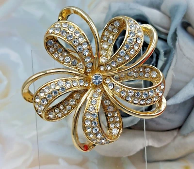 Signed Monet Gold Tone Clear Rhinestone Bow Flower Brooch Open Weave 2.5" - Image 1 of 4