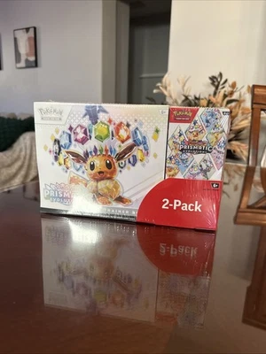 Pokémon Evoluciones Prismáticas Costco Booster Paquete 2 Paquete Sellado Foto 1 de 3