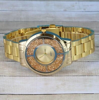 Reloj de lujo con bisel de metal para mujer Foto 1 de 4