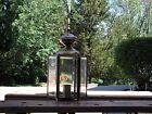 yard lamp with black 7  foot post. Antique brass Top.
