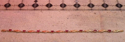 10K white yellow gold natural ruby bracelet 7 5/8 tip to tip 4.2g 8 rubies 5X3mm - Image 1 of 4