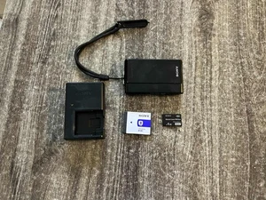 Cámara Sony Cyber-shot DSC-T900 - ¡Negra con batería, tarjeta SD y cargador! Probado - Imagen 1 de 7