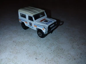 Matchbox Land Rover Ninety 1987 blanco 1 policía de rescate a cuadros con parada naranja - Imagen 1 de 5