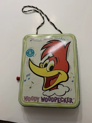 Juguete de manivela litográfica de hojalata pájaro carpintero leñoso fabricante de música Mattel 1963 vintage Foto 1 de 2