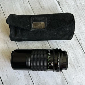 OBIETTIVO CANON FD 200 MM 1:4 VINTAGE USATO OBIETTIVO NERO CON TAPPO E CUSTODIA - Foto 1 di 14