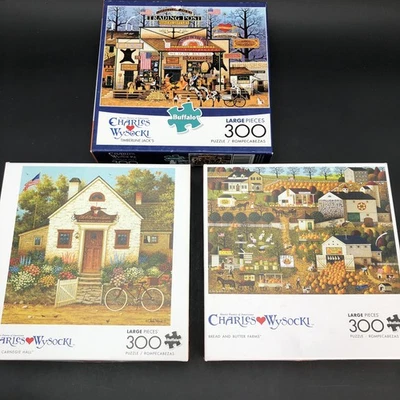Lot of 3 Charles Wysocki 300 piece Buffalo Jigsaw Puzzles Pumpkins Horse Bicycle - Image 1 of 4