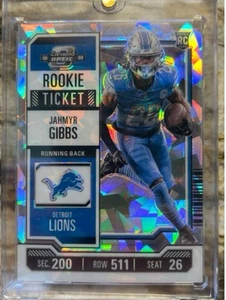 Boleto de novato Panini Optic 2023 Jahmyr Gibbs #70 Cracked Ice Prizm 19/22 - Imagen 1 de 2