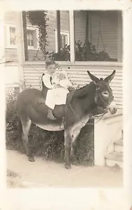 VINTAGE RPPC REAL PHOTO POSTCARD BOY HOLDS BABY ON DONKEY REPAIRED 072124 T - Picture 1 of 2