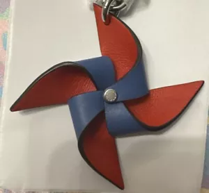 NWT COACH Leather Bag Charm 3.5" Red & Blue Pinwheel CU257 Keychain Clip Fob - Picture 1 of 6