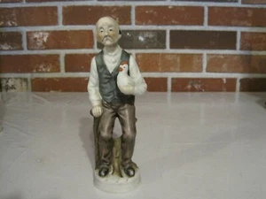 VINTAGE CERAMIC / PORCELAIN ELDERLY MAN HOLDING CHICKEN - Picture 1 of 10